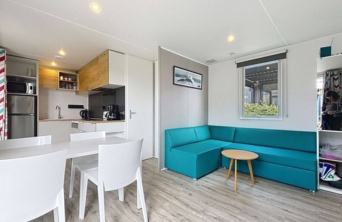 Jullouville-les-Pins House | Cozy 2BR Mobile Home, Pool, 200m from Beach, 4 Guests, Parking, Fitness & More!