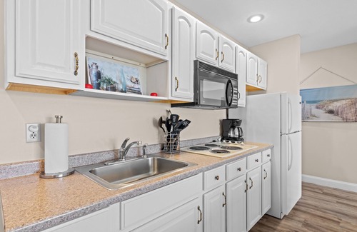 Kewadin Condo | Cozy 3-bedroom condo overing looking Torch Lake on the A-Ga-Ming Golf Course