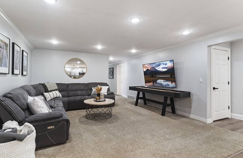 Layton House | Cozy basement with large yard