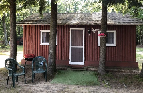 Pentwater Cabin | Cozy "Beach" Cabin in the woods with Pentwater Lake frontage and access
