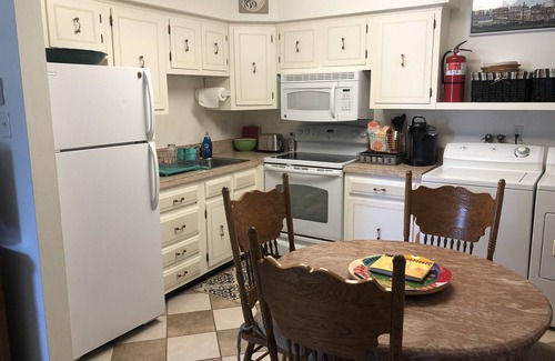 Village Green House | Cozy Beach Cottage in Island’s residential neighborhood!