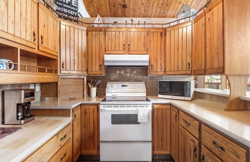 Swansea Point Cabin | Cozy Beach Front getaway, with mountains and lake views all around.