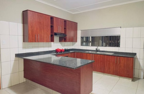 Matsapha House | Cozy bedroom ensuite, fully equipped retreat.