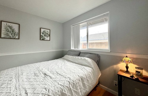 Thurston House | Cozy bedroom with shared bathroom