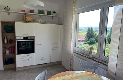 Hessisch Oldendorf House | Cozy, bright vacation home with beautiful views, sunny balcony, tiled stove