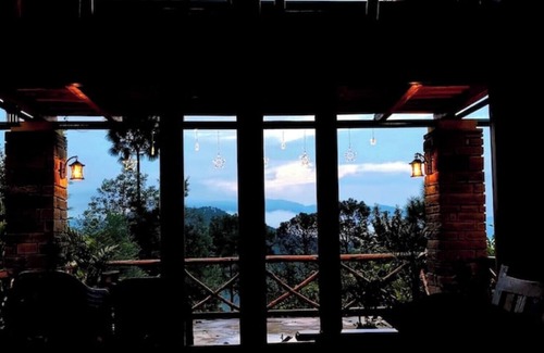 Almora House | Cozy bungalow nestled in the Himalayas, snow-capped peaks, Kumaoni culture.