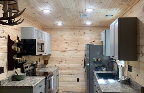 Counce Cabin | Cozy cabin in the woods. Close to boat ramp. Shared 5 bay boat storage