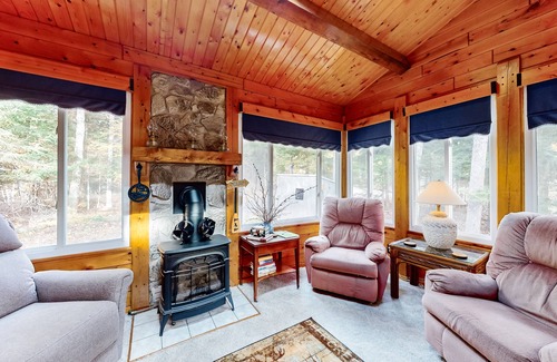 Beaver Cove House | Cozy cabin with covered porch, firepit, grill, fireplace, & washer/dryer