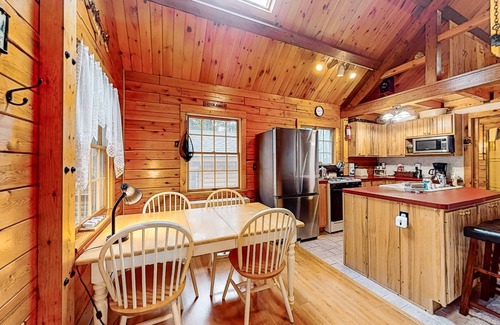 Beaver Cove House | Cozy cabin with covered porch, firepit, grill, fireplace, & washer/dryer