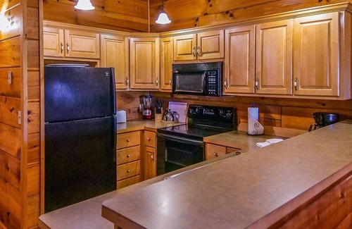 Spencer Cabin | Cozy cabin with fire pit, hot tub, and pool, and a swing set in the backyard!