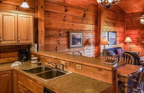 Spencer Cabin | Cozy cabin with fire pit, hot tub, and pool, and a swing set in the backyard!