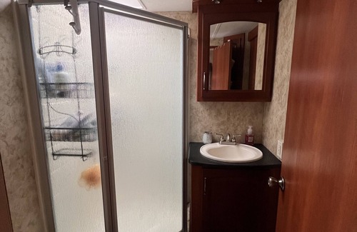Charlotte House | Cozy camper trailer with great views of the sky. Fire pit great for entertaining