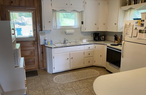 Angola Cottage | Cozy Classic Cottage Right on The Water + Private Dock