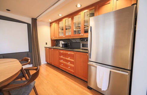 Mount Royal Cottage | Cozy Cliff Bungalow Cottage: Inner City Oasis with Home Theater and Parking!