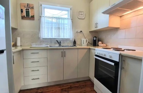 Berrima House | Cozy comfort awaits at Ronelle Cottage — your home away from home.