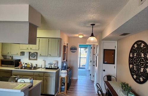 North Carolina Coast Condo | Cozy condo located one block from Carolina Beach and Freeman Park.