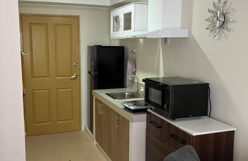 Dumaguete Apartment | Cozy condo with AC and fitness room in lovely Dumaguete steps from the Ocean