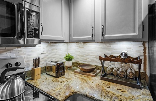 Chalet Village Condo | Cozy Condo with Wood-burning FP & Patio Gliders