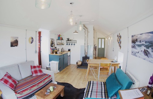 Clachtoll House | Cozy converted barn with mountain and sea views on the NC500. Pet-friendly!
