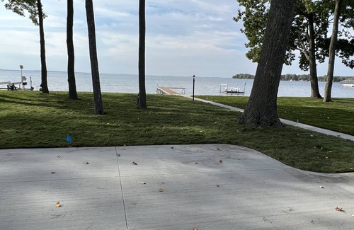 Houghton Lake House | Cozy Cottage, fresh laid sod, new concrete patio and sidewalk, sandy beach!