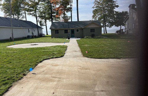 Houghton Lake House | Cozy Cottage, fresh laid sod, new concrete patio and sidewalk, sandy beach!