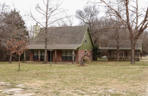 Rosston Cottage | Cozy cottage nestled next to Hart's Creek, surrounded by trees and wildlife.