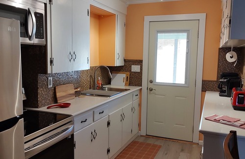 Supply Cottage | Cozy Cottage one mile from the Beach and Boat Ramp! Pet Friendly Too!