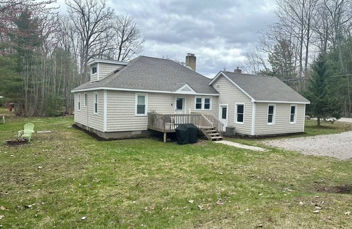 Higgins Lake House | Cozy cottage with Higgins Lake peek-a-boo views