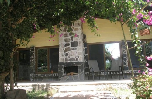 Panajachel Cottage | Cozy country cottage with wooden ceilings and stone walls within nature reserve.