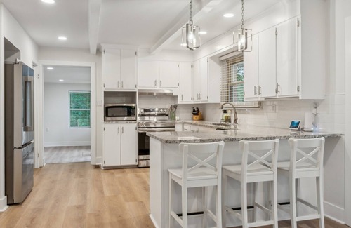 Southmont House | Cozy Cove-Lakefront home with kayaks, paddle board, lillypad, arcade, & fire pit