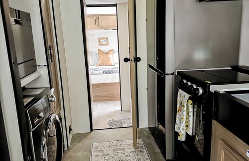 Kurtz RV Rental | Cozy glamper with scenic pond in Brownstown Indiana