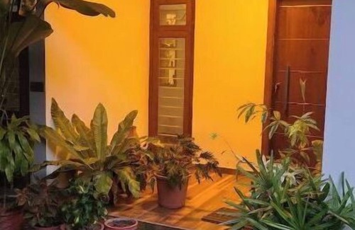 Varkala House | Cozy Glass Villa home. Five minutes walk to the happening Varkala cliff