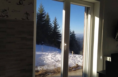 Kopaonik Apartment | Cozy ground level apartment with outdoor access across from Kraljevi Čardaci.