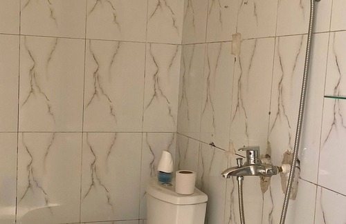 Limete House | Cozy Guest Room in Kinshasa with Balcony and Partial Air-Conditioning