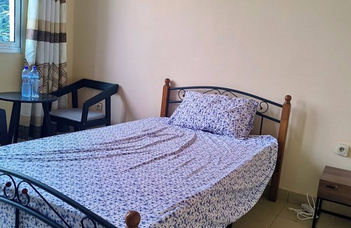 Limete House | Cozy Guest Room in Kinshasa with Balcony and Partial Air-Conditioning