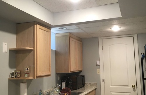 Carrolltowne House | cozy guest room with private bath kitchenette