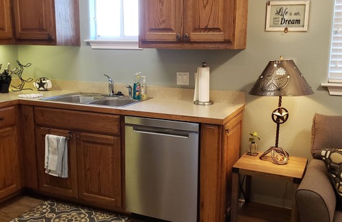 Dripping Springs Cottage | Cozy hilltop guesthouse at Barkspin Oaks Ranch. Beautiful views!