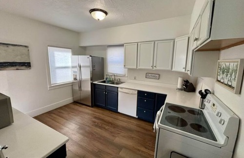 Sioux Falls House | Cozy home near DT, Premier Center & Hospital- Foosball, 65"TV & Fenced Yard