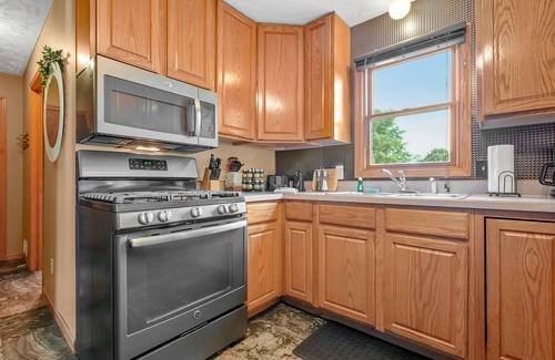 Traverse City House | Cozy Home | Near Lake, Hot Tub, Pets Ok & Fire Pit