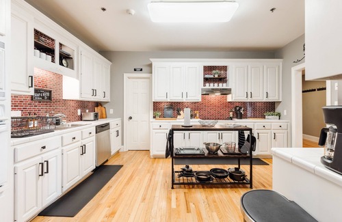 Greenville Downtown Apartment | Cozy Industrial 2-KING Bdrm S. Main Street Downtown Condo w/Foosball Table