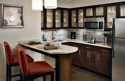 Plano Condo | Cozy King Suite | Seasonal Outdoor Pool, 24-Hour Business Center and Fitness Center