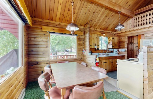 Rollins Cabin | Cozy lakefront log cabin with lake views, vintage decor, & dock