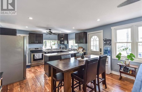 Severn Cottage | Cozy Lakeside Cottage Retreat with Kayaks, Paddle Boat & Sunset Waterfront Views