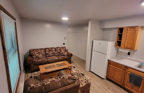 Bellaire RV Rental | Cozy little cabin in a campground backed up to the peaceful woods.