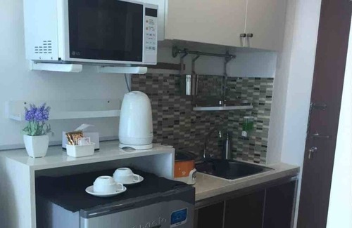 Kayu Putih Apartment | Cozy Modern Studio Room at Tifolia Apartmemt