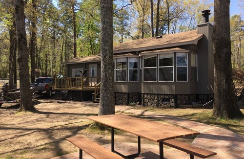 Houston House | Cozy on the lake lodging with kayaking and fishing supplies furnished.