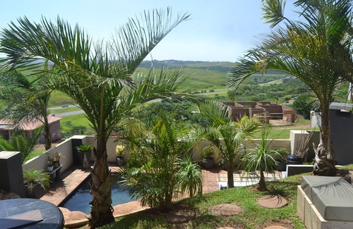 Kingsburgh House | Cozy one bedroom suite, with a balcony, overlooking the pool and braai area.