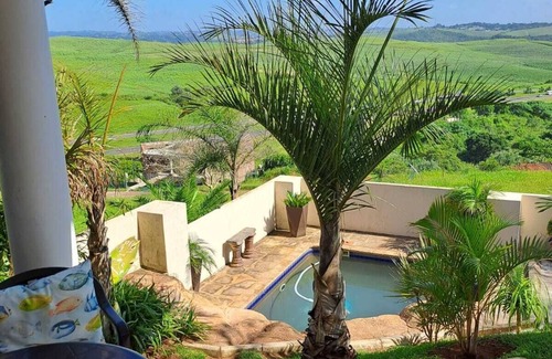 Kingsburgh House | Cozy one bedroom suite, with a balcony, overlooking the pool and braai area.