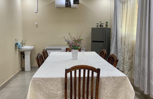 Lusaka Cottage | Cozy, quiet and beautiful two bedroom gated cottage. Full kitchen & pool access.