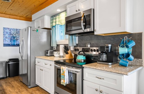 Traverse City Cottage | Cozy remodeled cottage directly on Bass Lake. Ten minutes to Traverse City.